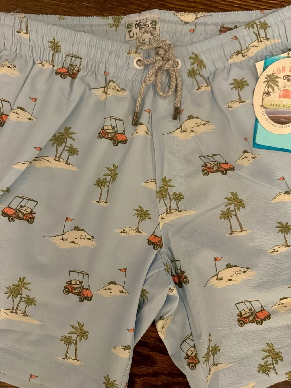 Free Planet Men’s Light Blue Golf Cart & Palm Print Swim Trunks- Medium
